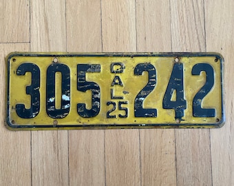 May include: A yellow and black California license plate from 1925 with the number 305242.