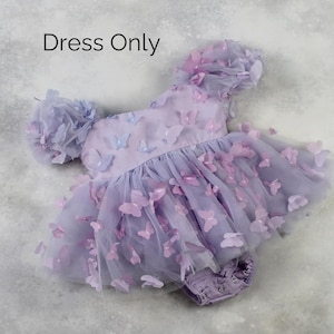 First birthday baby girl lavender butterfly dress with puffy short sleeves and built in romper/ bodysuit dress.