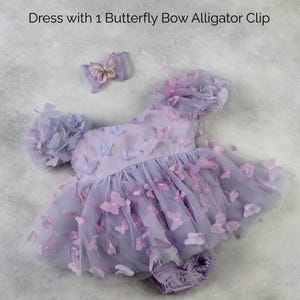 First birthday baby girl lavender butterfly dress with puffy short sleeves and built in romper/ bodysuit dress.