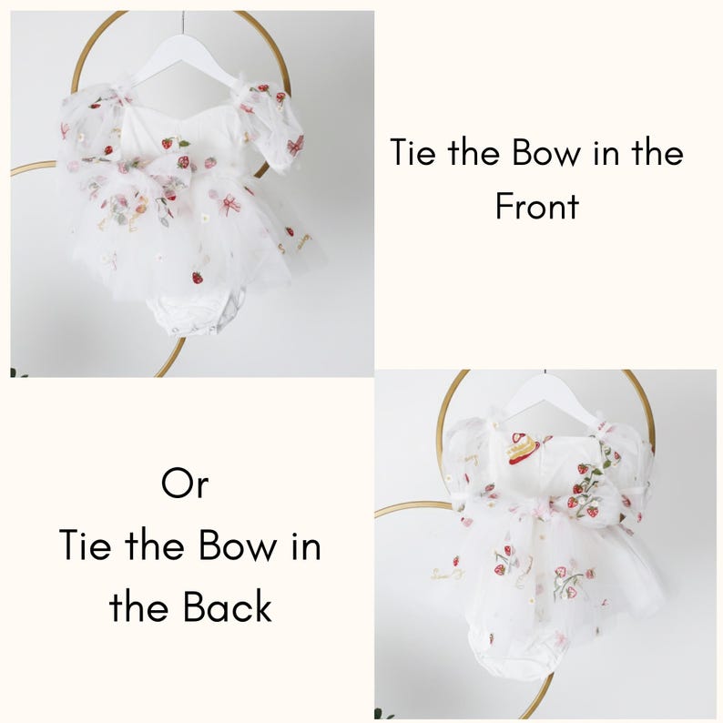 May include: White baby romper with floral embroidery, including strawberries and small flowers. The romper has puff sleeves and a tulle skirt. Text on the image reads "Tie the Bow in the Front" and "Tie the Bow in the Back".