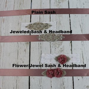 May include: Three different styles of sashes and headbands. The top sash is plain dusty rose. The middle sash has a jeweled embellishment and the text "Jeweled Sash & Headband". The bottom sash has a flower and jeweled embellishment and the text "Flower/Jewel Sash & Headband".