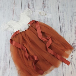 Full length burnt orange flower girl dress with white lace