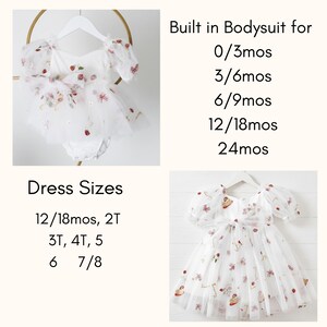 May include: White baby dress with a built-in bodysuit, adorned with strawberry and bow details. The dress features short, puffy sleeves and a tulle overlay. Sizes available include 0/3mos to 24mos, and dress sizes from 12/18mos to 7/8.