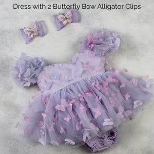 First birthday baby girl lavender butterfly dress with puffy short sleeves and built in romper/ bodysuit dress.