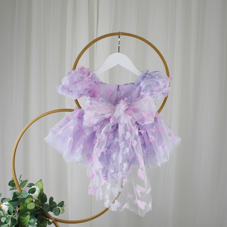 First birthday baby girl lavender butterfly dress with puffy short sleeves and built in romper/ bodysuit dress.