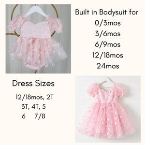 May include: A light pink dress with puff sleeves and butterfly appliques. The text reads: Built in Bodysuit for 0/3mos, 3/6mos, 6/9mos, 12/18mos, 24mos. Dress Sizes 12/18mos, 2T, 3T, 4T, 5, 6, 7/8. The garment features a full, layered tulle skirt.