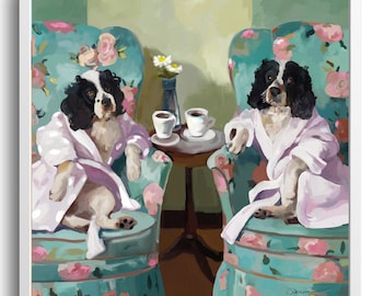 May include: Two dogs wearing pink robes sit in floral armchairs with cups of coffee on a table between them. The chairs are teal blue with pink and white floral patterns. The dogs are black and white with brown eyes.