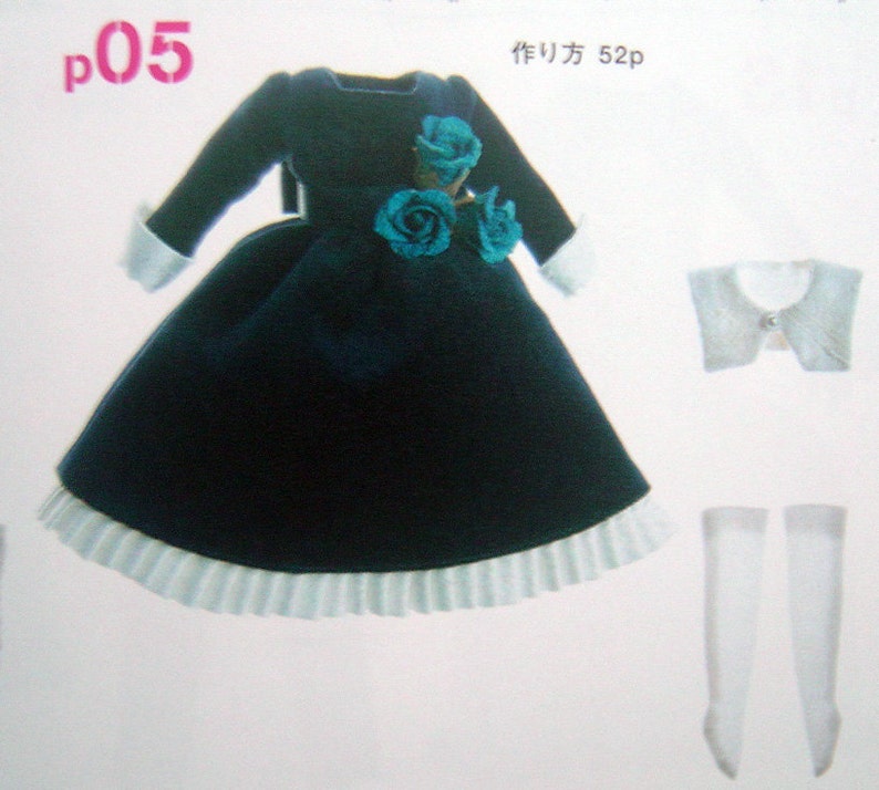 May include: A dark blue velvet dress with a white lace trim and a blue flower embellishment. The dress is accompanied by a white lace collar and white stockings.