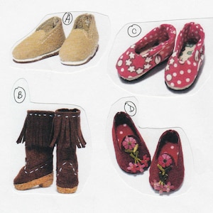 May include: A set of four pairs of miniature shoes. Two pairs are brown suede slip-ons, one pair is red with white polka dots, and one pair is red with embroidered flowers.