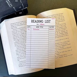 May include: A reading list with a goal of 10 books. The list is dated 4/14 and the first book listed is "Eclipse" with a five-star rating.