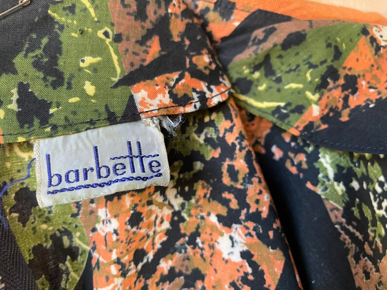 1950s Cotton Batik Day Dress by Barbette 34 Sleeve Pleated Full Skirt Orange Green and Black Mid Century Stepford New Look