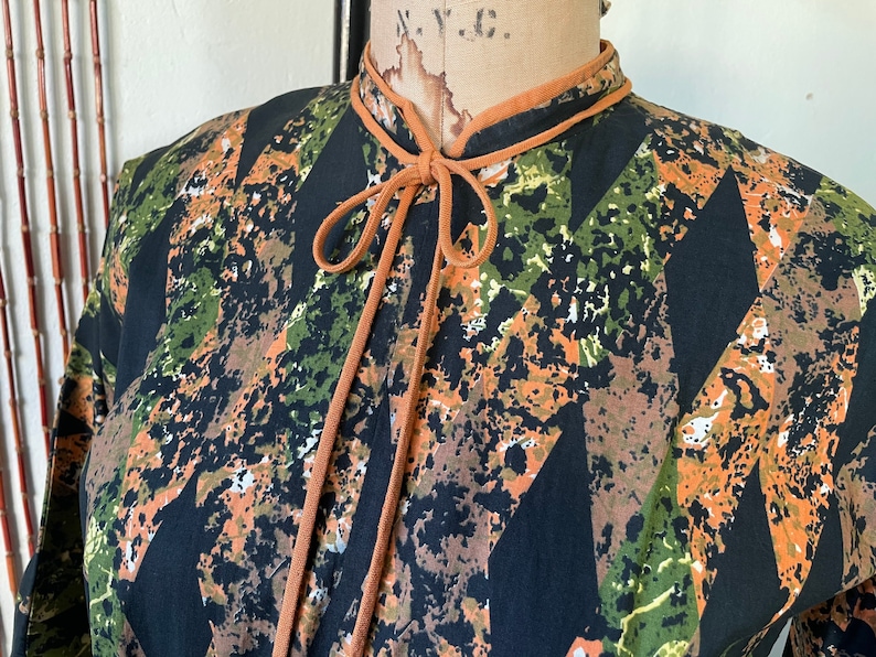 1950s Cotton Batik Day Dress by Barbette 34 Sleeve Pleated Full Skirt Orange Green and Black Mid Century Stepford New Look