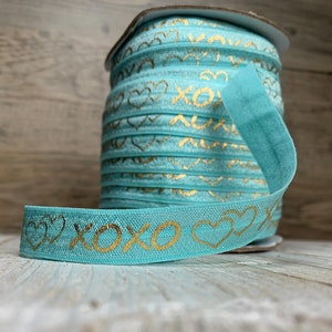 5/8” agua turquoise and Gold Metallic “xoxo” Print Fold Over Elastic, elastic by the yard, turquoise FOE, DIY