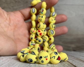 Polymer clay beads, 12 mm happy face beads, yellow happy faces in a pack of 6 beads.