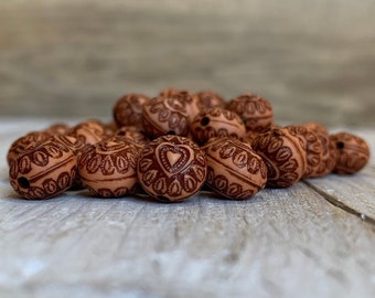 Carved brown puffy pillow beads 10 mm (20)