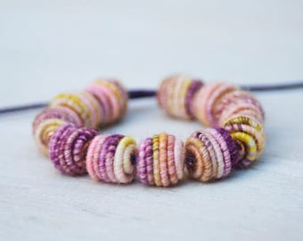 Small handmade fabric textile beads for handmade jewelry designs