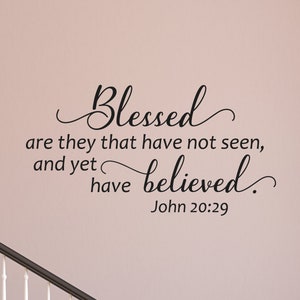 May include: Black and white wall decal with the quote "Blessed are they that have not seen, and yet have believed." John 20:29.