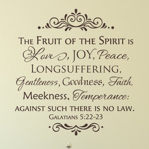 May include: A brown decorative wall decal with a quote from the Bible: "The fruit of the Spirit is love, joy, peace, longsuffering, gentleness, goodness, faith, meekness, temperance: against such there is no law."  The quote is from Galatians 5:22-23.