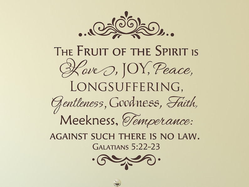 May include: A brown decorative wall decal with a quote from the Bible: "The fruit of the Spirit is love, joy, peace, longsuffering, gentleness, goodness, faith, meekness, temperance: against such there is no law."  The quote is from Galatians 5:22-23.
