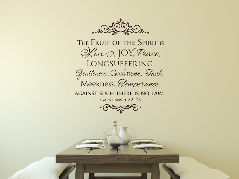 May include: A brown wall decal with a decorative flourish and the text "THE FRUIT OF THE SPIRIT IS Love, JOY, Peace, LONGSUFFERING, Gentleness, Goodness, Faith, Meekness, Temperance: AGAINST SUCH THERE IS NO LAW. GALATIANS 5:22-23"