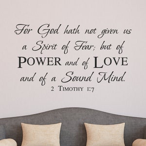 May include: Black and white text on a light gray wall. The text reads: "For God hath not given us a Spirit of Fear; but of POWER and of LOVE and of a Sound Mind. 2 TIMOTHY 1:7"