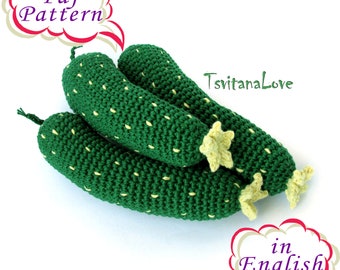 May include: Three handmade green crochet zucchini with yellow accents and small yellow flower details. The image includes the text "Pdf Pattern" and "in English". The artist's name "TsvitanaLove" is also visible.