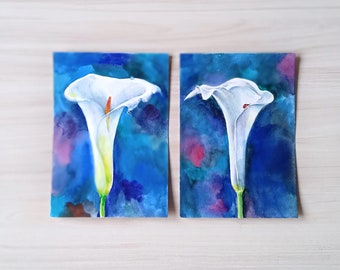 Drawing with watercolor on paper. 8,5x6 inches. Two paintings together. White callas on a blue background With a drop of water and a ladybug