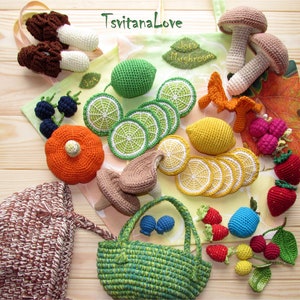 May include: A collection of crocheted food items, including mushrooms, limes, lemons, strawberries, blueberries, and a poppy. The items are arranged on a wooden surface with a green and brown tote bag in the background. The tote bag has the text "Jo's Mushrooms" and "TsvitanaLove" printed on it.
