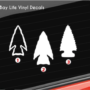 May include: White vinyl decals of three different arrowhead designs. The decals are numbered 1, 2, and 3. The text "Bay Life Vinyl Decals" is at the top of the image, with a bird graphic.