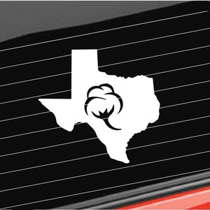 May include: White vinyl decal of the state of Texas with a cotton boll in the center.