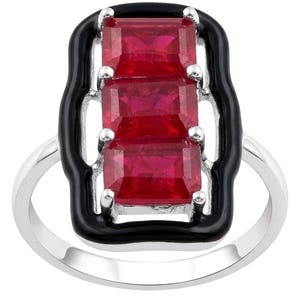 May include: A silver ring featuring a rectangular black enamel frame that surrounds three vertically aligned, emerald-cut red gemstones. The stones are held in place by small silver prongs, and the band of the ring is a smooth, polished silver metal.