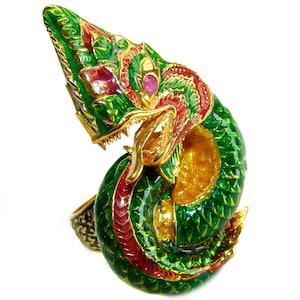 May include: A green, gold and red enamel dragon ring with ruby accents. The dragon is coiled and has a fierce expression.