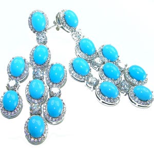 Pendientes de turquesa Sleeping Beauty en oro blanco de 18 quilates sobre plata de ley con gema azul ovalada, joyería única hecha a mano.