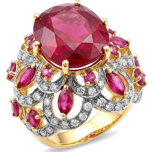 May include: A gold ring featuring a large, round, faceted red gemstone at the center, surrounded by a decorative openwork gallery. The setting is adorned with multiple smaller marquise and round-cut red gemstones and numerous tiny white diamonds.