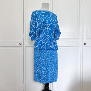 nora noh silk dress Nora Noh Peacock Blue Herringbone Dress at Baby & Company