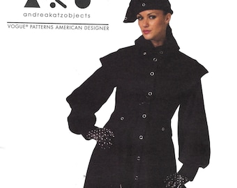 May include: A black long-sleeved coat with a high collar and a belt. The coat has a flared skirt and is decorated with small black dots. The model is wearing a black hat with a pointed crown and black boots.