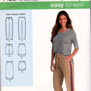 May include: Simplicity sewing pattern number 1428, size 6-14, for pants and skirts. The pattern includes instructions for making a pair of pants with a stripe down the side and three different skirts. The pattern is designed by Karen Z and printed in the USA.