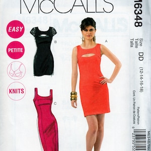 May include: McCall's sewing pattern for a dress, size DD (12-14-16-18). The pattern includes three different styles: a black dress with a keyhole neckline, a red dress with a keyhole neckline, and a pink dress with a square neckline. The pattern is labeled "Easy" and "Petite".