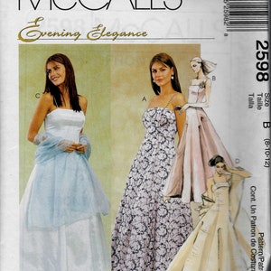 May include: McCall's Evening Elegance sewing pattern for a dress, size B (8-10-12). The pattern shows three different styles of dresses: a white dress with a sheer overlay, a floral print dress, and a cream-colored dress.