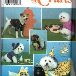 May include: Simplicity Crafts sewing pattern #4472 for making dog costumes. The pattern includes five different costumes: a witch, a cowboy, a princess, a biker, and a scarecrow. The pattern is for one size.