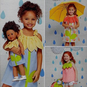 May include: A sewing pattern for a girl's dress with a flower design. The pattern is from Simplicity and is for sizes 3-8. The pattern includes a doll-sized version of the dress.