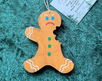 Hand-crafted wooden Gingerbread man with arm bitten off ornament. Please see description for more information.