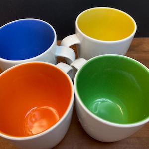Crate & Barrel White Mugs with Primary Colors inside. Set of 4