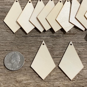 May include: A set of 12 unfinished wooden diamond shapes with a hole at the top. The diamonds are approximately the size of a US quarter.