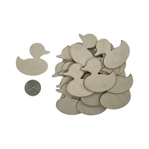 May include: A pile of unfinished wooden duck shapes, perfect for crafting projects. The ducks are about the size of a US quarter.
