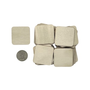 May include: A stack of 25 unfinished square wooden craft blanks, each measuring 2 inches by 2 inches. The blanks are made of natural wood and have a smooth surface. They are perfect for painting, staining, or decoupage.