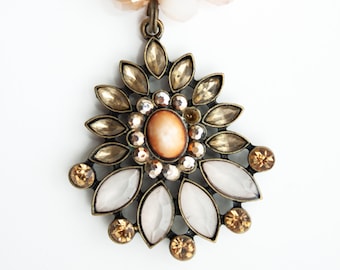 Nassau Royalty, Soft pink and orange glass and Czech Crystal pendent, Bronze hardware.