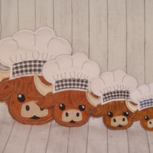 May include: Four embroidered felt patches of brown Highland cows wearing white chef hats with black and white checkered bands. The patches are different sizes.
