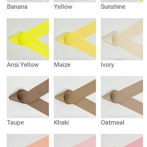 May include: A collection of 18 different colored ribbon samples, each folded in a V-shape. The colors include gold, yellow, ivory, taupe, khaki, oatmeal, light coral, baby pink, rose pink, pink, coral rose, and coral.