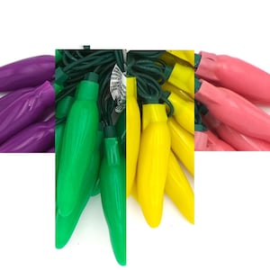 May include: A collection of colorful string lights in the shape of chili peppers. The lights are in shades of purple, green, yellow, and pink. The green lights are clustered together with a green wire.